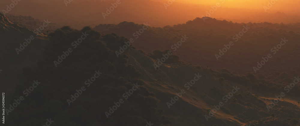 Bushy mountains at hazy sunset