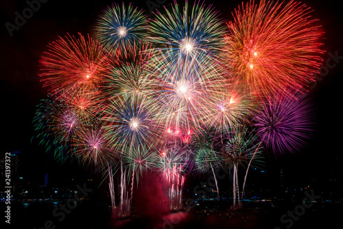 Colorful fireworks of various colors at night with celebration and anniversary concept