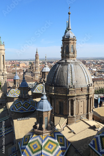 The christian Pilar Cathedral (Catedral del Pilar) bell towers and central dome, with colored tiles, in summer, in Zaragoza, Aragon region, Spain