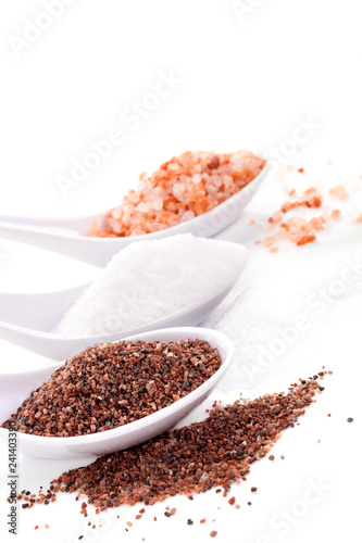 Himalayan and kitchen salts in spoons