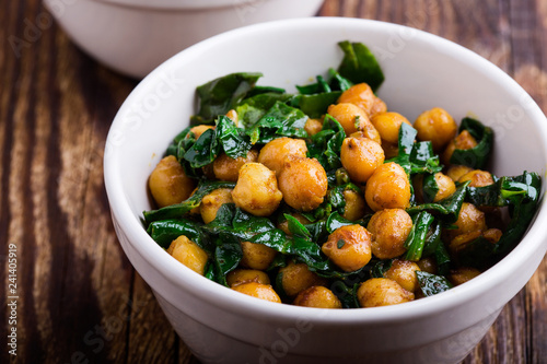 Spinach with chickpeas salad bowl photo