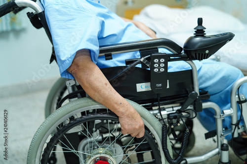 Asian senior or elderly old lady woman patient on electric wheelchair with remote control at nursing hospital ward : healthy strong medical concept  photo