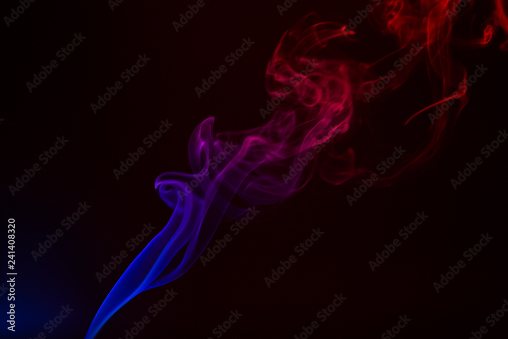 Colorful smoke close-up on a black background Colorful smoke close-up on a black background