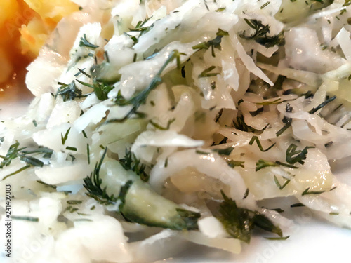 Salad with cucumber and cabbage.