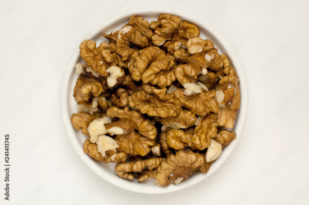 Walnuts on a white. The view from the top Walnuts on a white. The view from the top