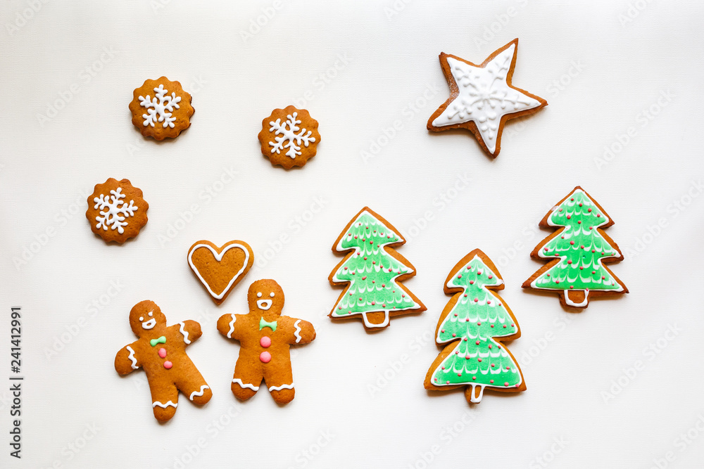Handmade festive gingerbread cookies in the form of stars and Christmas trees and hearts for Valentine's Day