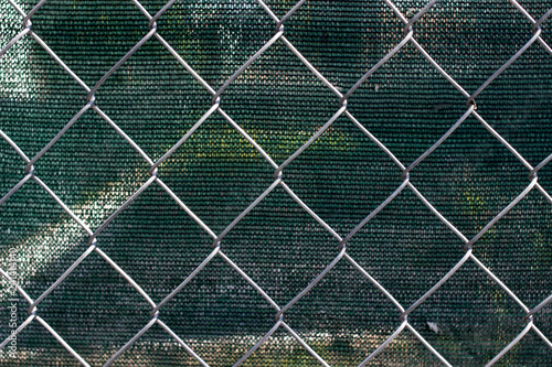 Chain link fence with fabric screen