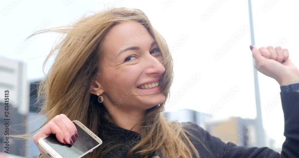 Portrait of young pretty girl clicking on the air Portrait of young pretty girl clicking on the air