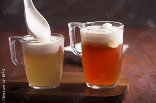 Two sorts of cheese tea with layer of creamy foam