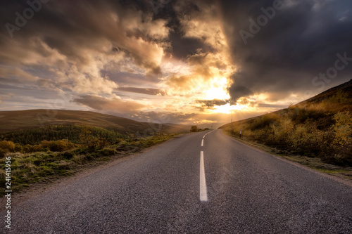 Great Britain, Scotland, Highlands, road at sunset