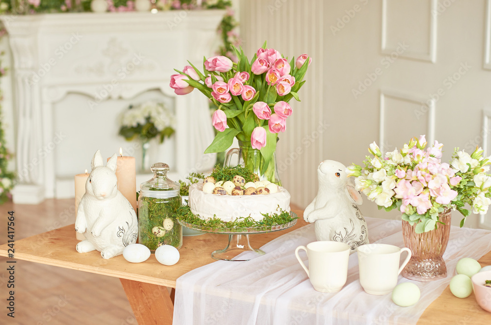 Happy Easter! Holiday Decorations. Beautiful festive Easter table setting with bunny, flowers and eggs. Spring color theme, copy space.Easter Greeting Card Template. Kitchen interier. 