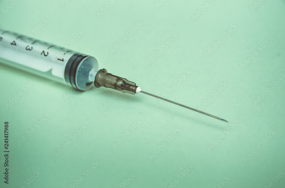 syringe and pills are on the table, medical supplies are on the table syringe and pills are on the table, medical supplies are on the table