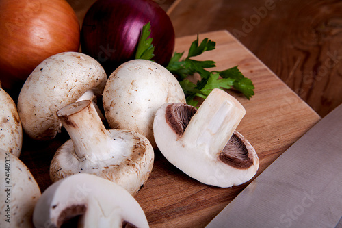  Fresh mushrooms on a wooden background.