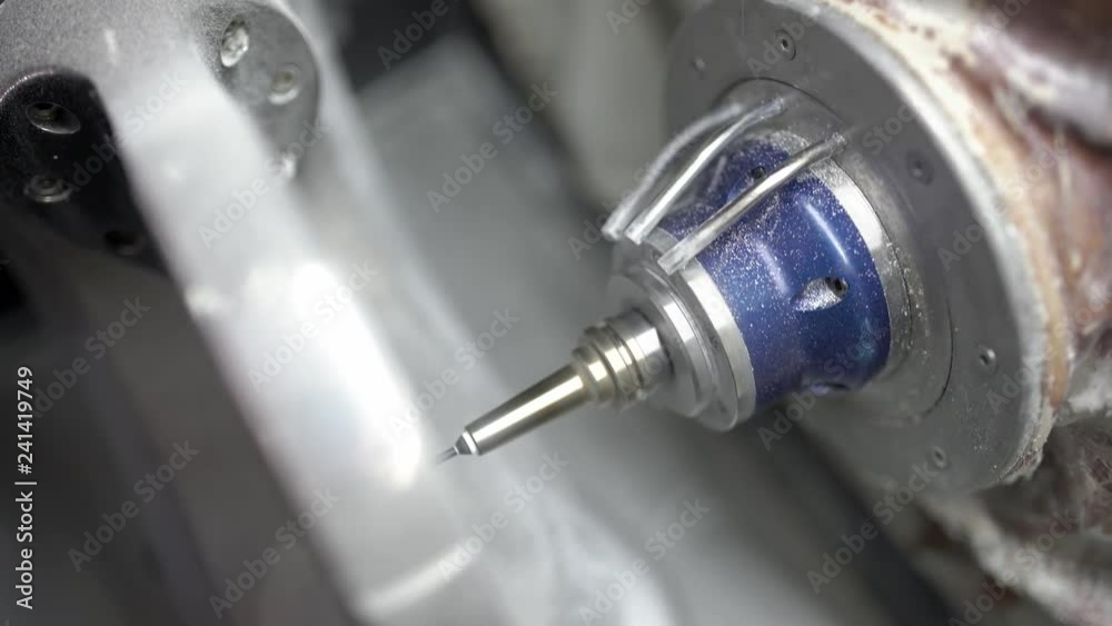 Closeup view at carving process in dental milling machine Closeup view at carving process in dental milling machine