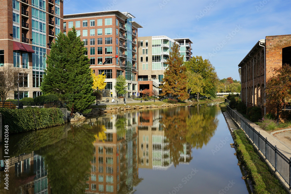Greenville cityscape - buildings reflecting in Reedy River