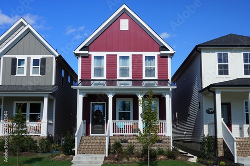 Two story, red, row house in a suburban neighborhood in North Carolina photo