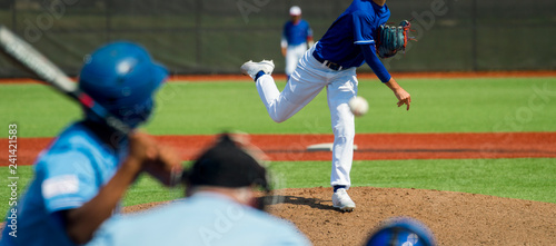 Pitcher and third baseman during a baseball game photo