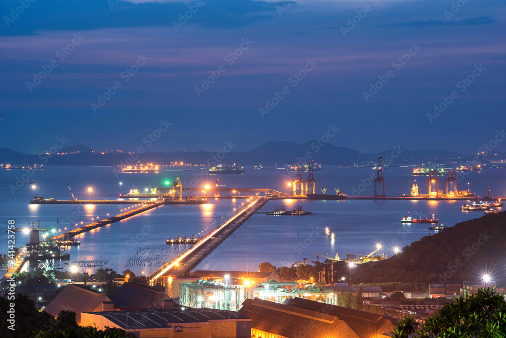 Container ship in export and import business logistics and transportation. Cargo and container box shipping to harbor by crane. Water transport International. Aerial view and top view.
