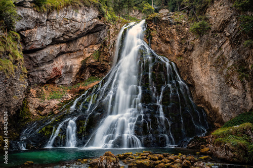 Beautiful view of famous Gollinger Wasserfall with mossy rocks and green trees  Golling  Salzburger Land  Austria