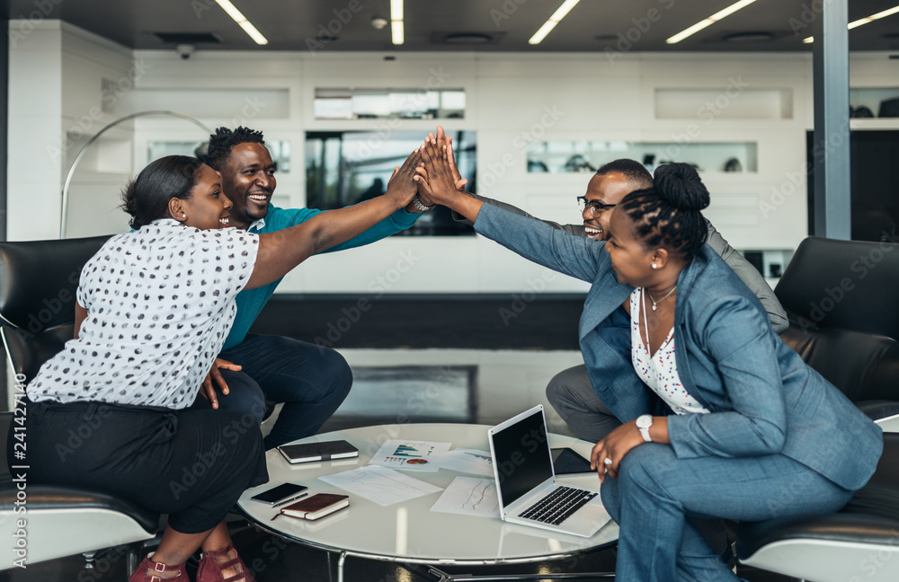 Friendly successful all african business team give high five together in office, excited happy employees celebrating corporate victory, african workers teambuilding concept - obrazy, fototapety, plakaty 