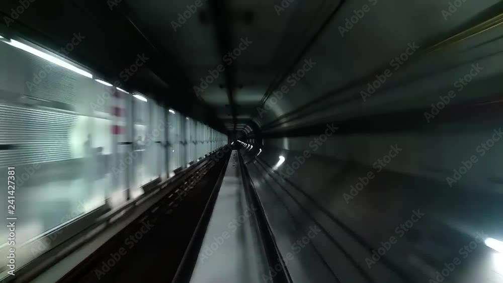 Fast underground train riding in a tunnel of the modern city Fast underground train riding in a tunnel of the modern city
