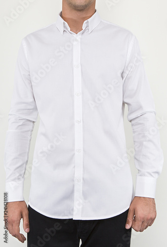 Wallpaper Mural Handsome and confident young man wearing shirt while standing on white background. Torontodigital.ca