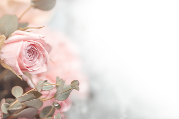 Flowers bouquet close up. Decoration made of roses  and decorative plants. Place for text.
