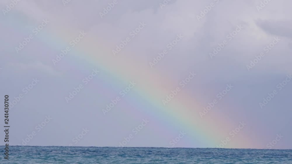 Rainbow in the Mediterranean sea after rain and thunderstorms. Rainbow in the Mediterranean sea after rain and thunderstorms.