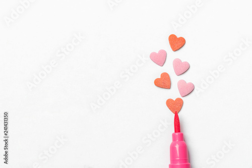 Red sugar candy sprinkles in heart shape pink brush pen on white paper background. Imitation of drawing illustration. Valentine Mother's day kids charity romantic love concept. Creative card poster
