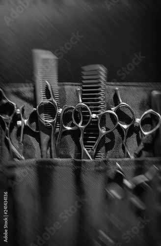Stylish professional barber scissors and combs, hairdresser salon concept, hairdressing tool set. Haircut accessories 