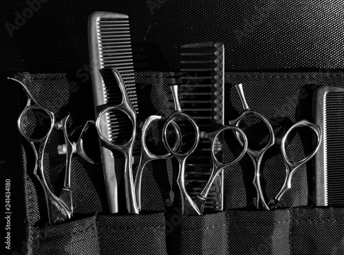 Stylish professional barber scissors and combs, hairdresser salon concept, hairdressing tool set. Haircut accessories 