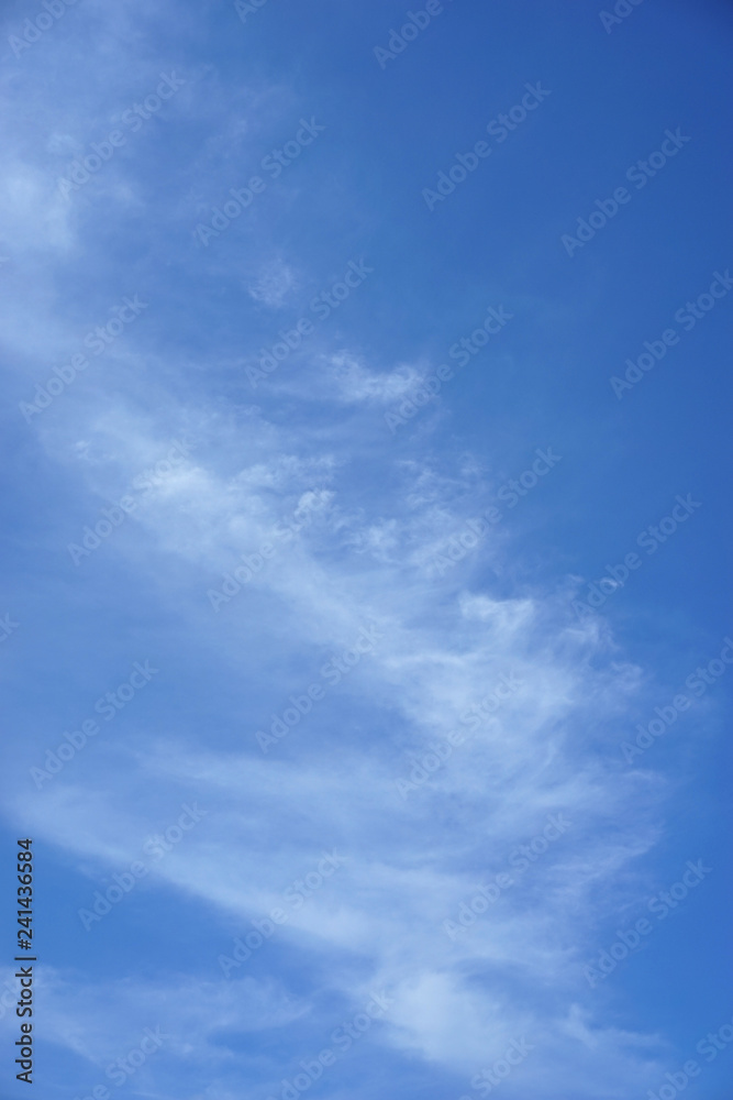 Blue skies and white clouds background. 