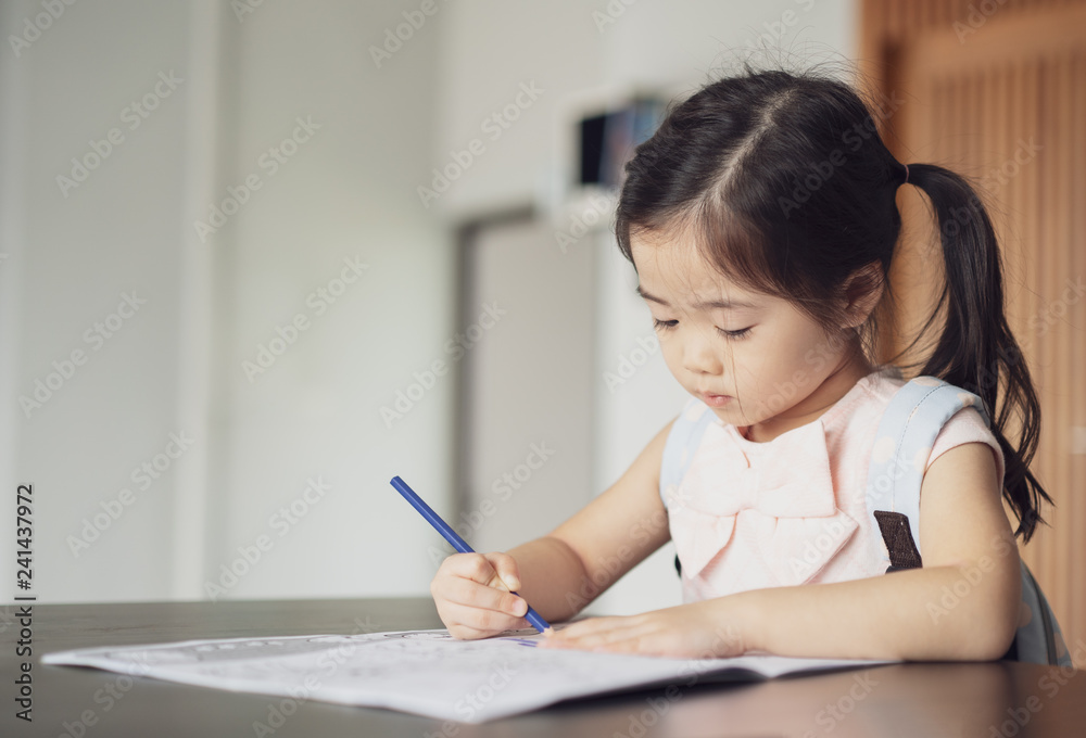 Back to school, Cute little girl painting a picture in home, Girl writing in notebook with pencil at her bedroom. Back to school, Cute little girl painting a picture in home, Girl writing in notebook with pencil at her bedroom.