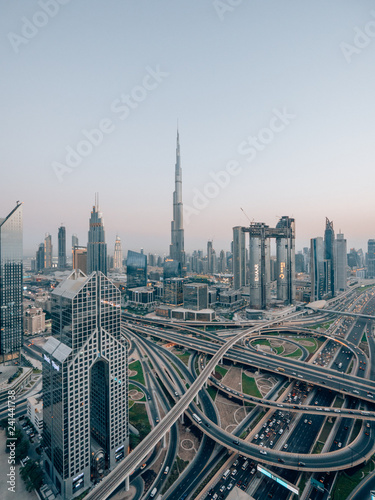 Skyline of Dubai with a huge street in front of the Burj Khalifa photo