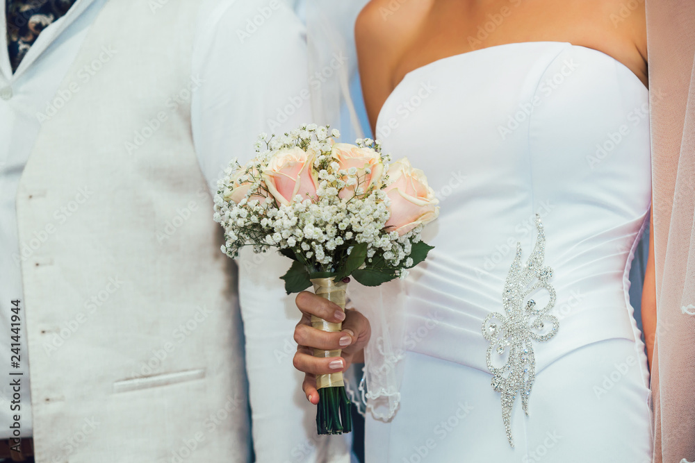 Wedding bouquet of flowers in brides' hands Wedding bouquet of flowers in brides' hands