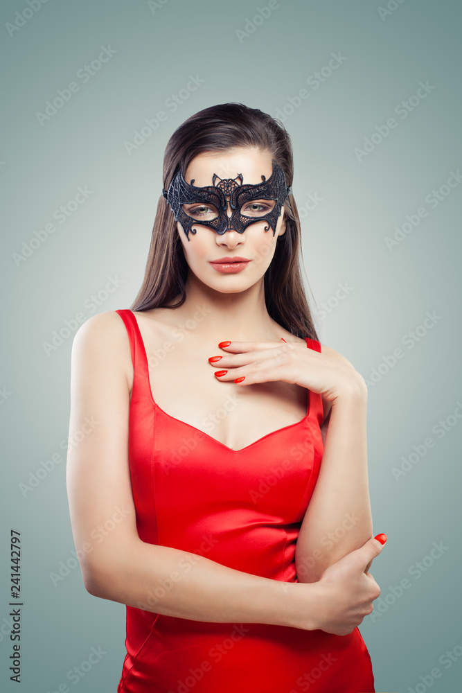 Sexy brunette woman in mask on background, portrait Sexy brunette woman in mask on background, portrait