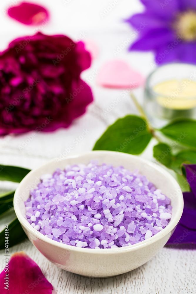 Purple Clematis Spa Salt for Spa and Aromatherapy. Selective focus. Purple Clematis Spa Salt for Spa and Aromatherapy. Selective focus.