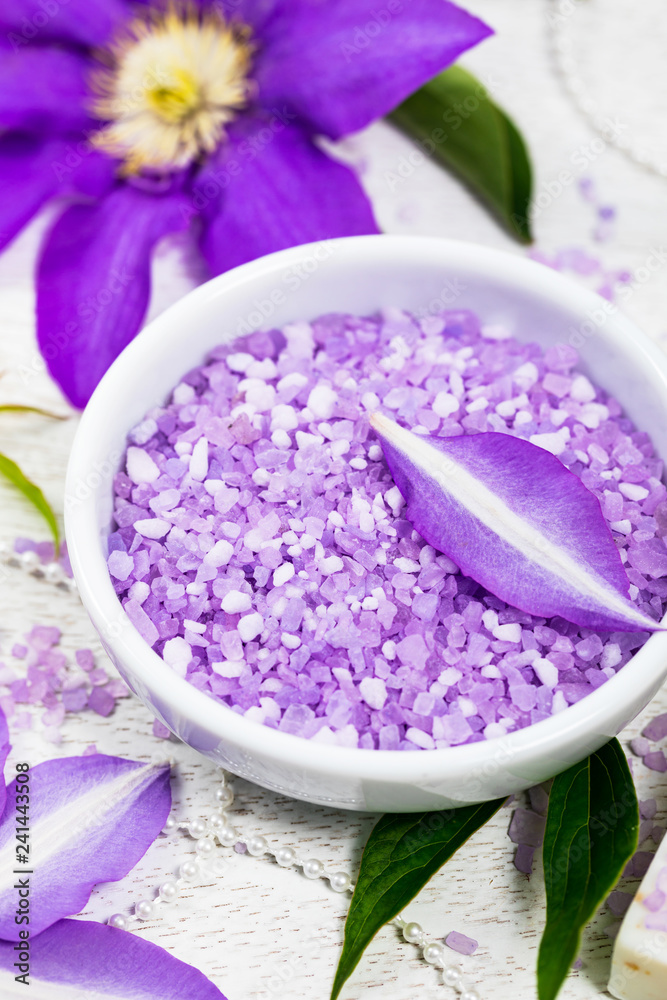 Purple Clematis Spa Salt for Spa and Aromatherapy. Selective focus. Purple Clematis Spa Salt for Spa and Aromatherapy. Selective focus.