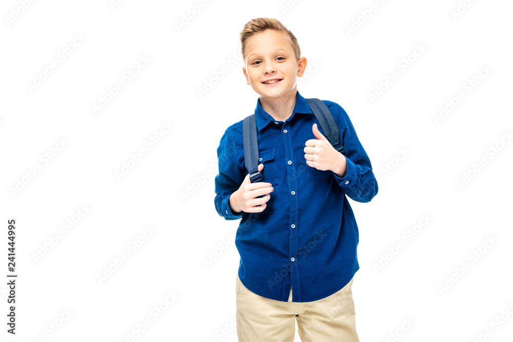 schoolboy in blue shirt showing thumb up and smiling at camera isolated on white schoolboy in blue shirt showing thumb up and smiling at camera isolated on white