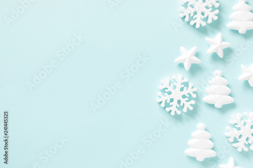Fototapeta Naklejka Na Ścianę i Meble -  Christmas modern composition. Pattern made of snowflakes on pastel blue background. Christmas, New Year, winter concept. Flat lay, top view, copy space 