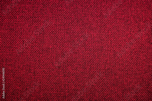 Textured background surface of textile upholstery furniture close-up. red Color fabric structure