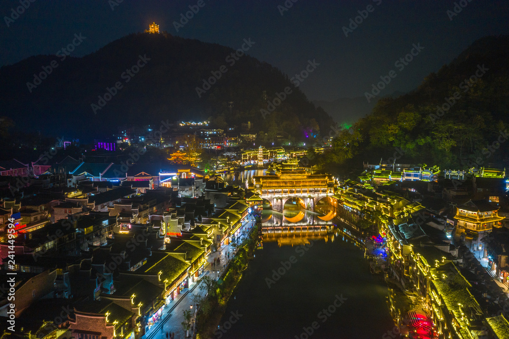 Fototapeta premium Beautiful bridge and old houses in Fenghuang Ancient Town at night