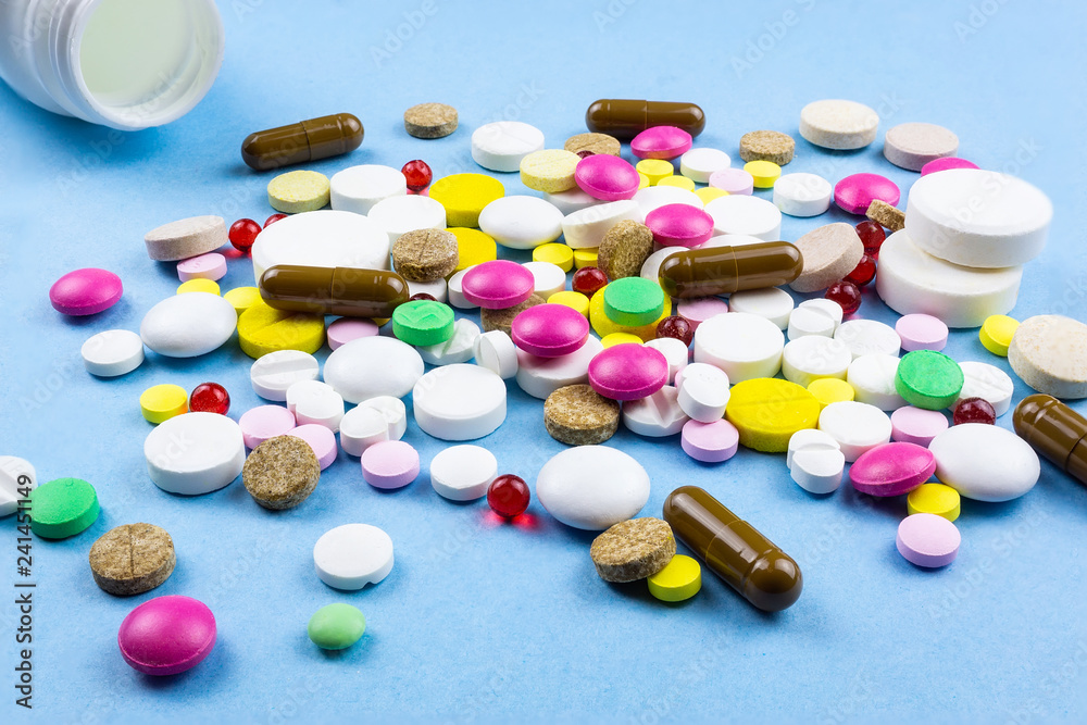 pills on a blue background pills on a blue background