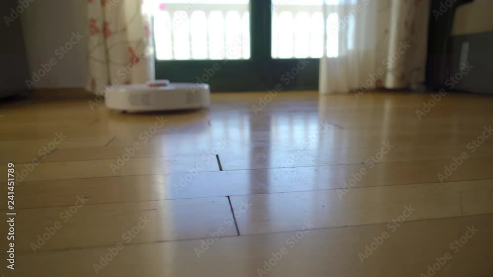 Robot vacuum cleaner cleans the floor from dust. Smart house Robot vacuum cleaner cleans the floor from dust. Smart house