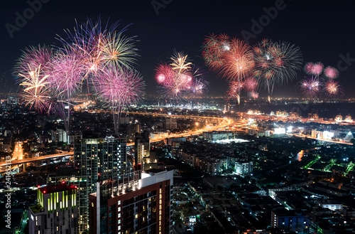 Cityscape of Bangkok metropolis with fire work celebration 