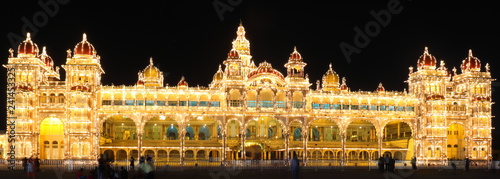 Beautiful Mysore palace brightly lit at night photo