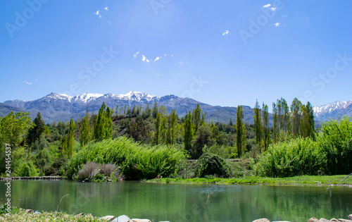 summer landscape mountains and pond. pond, forest, mountains, top view photo