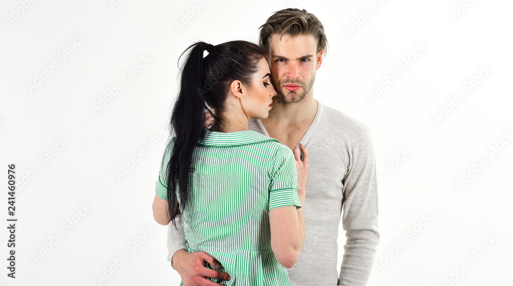 Valentines day and love. Romantic feelings concept. Romantic couple in love hug. Handsome unshaven man and pretty girl in love. Man and woman couple in love cuddle or hug on white background