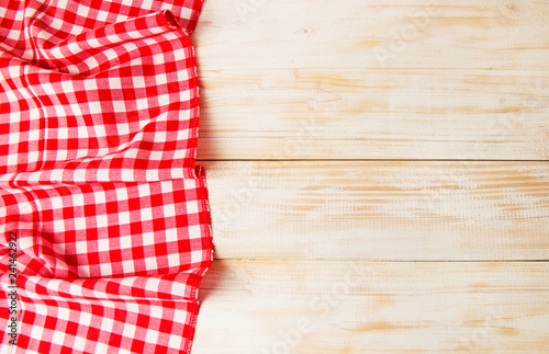 Red checkered tablecloth on a wooden table