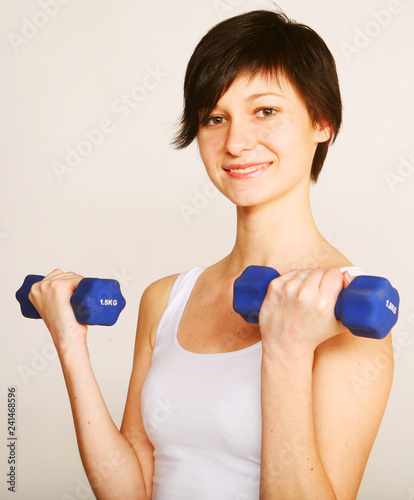 fitness woman lifting weights  photo